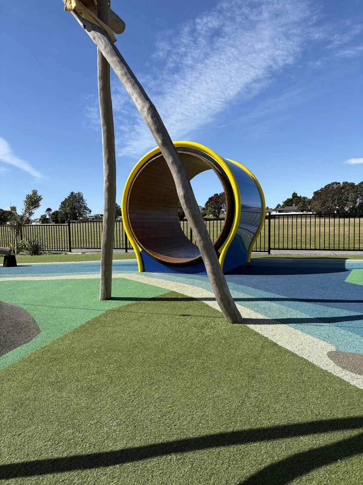 Giant hamster wheel on coloured rubber matting at Cass Square playground, Hokitika