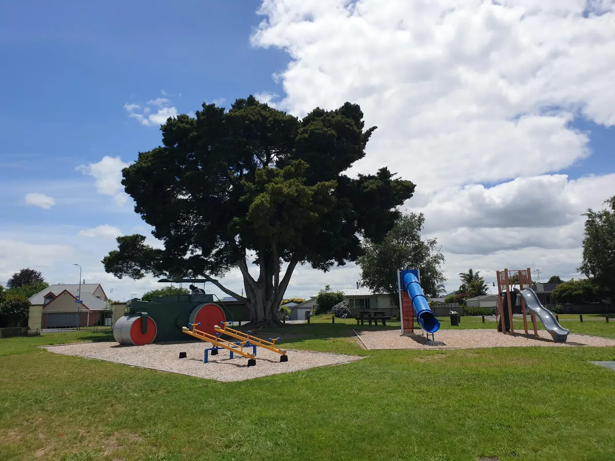 Steam roller play feature, seesaws and tube slide at Leamington Domain playground, Cambridge