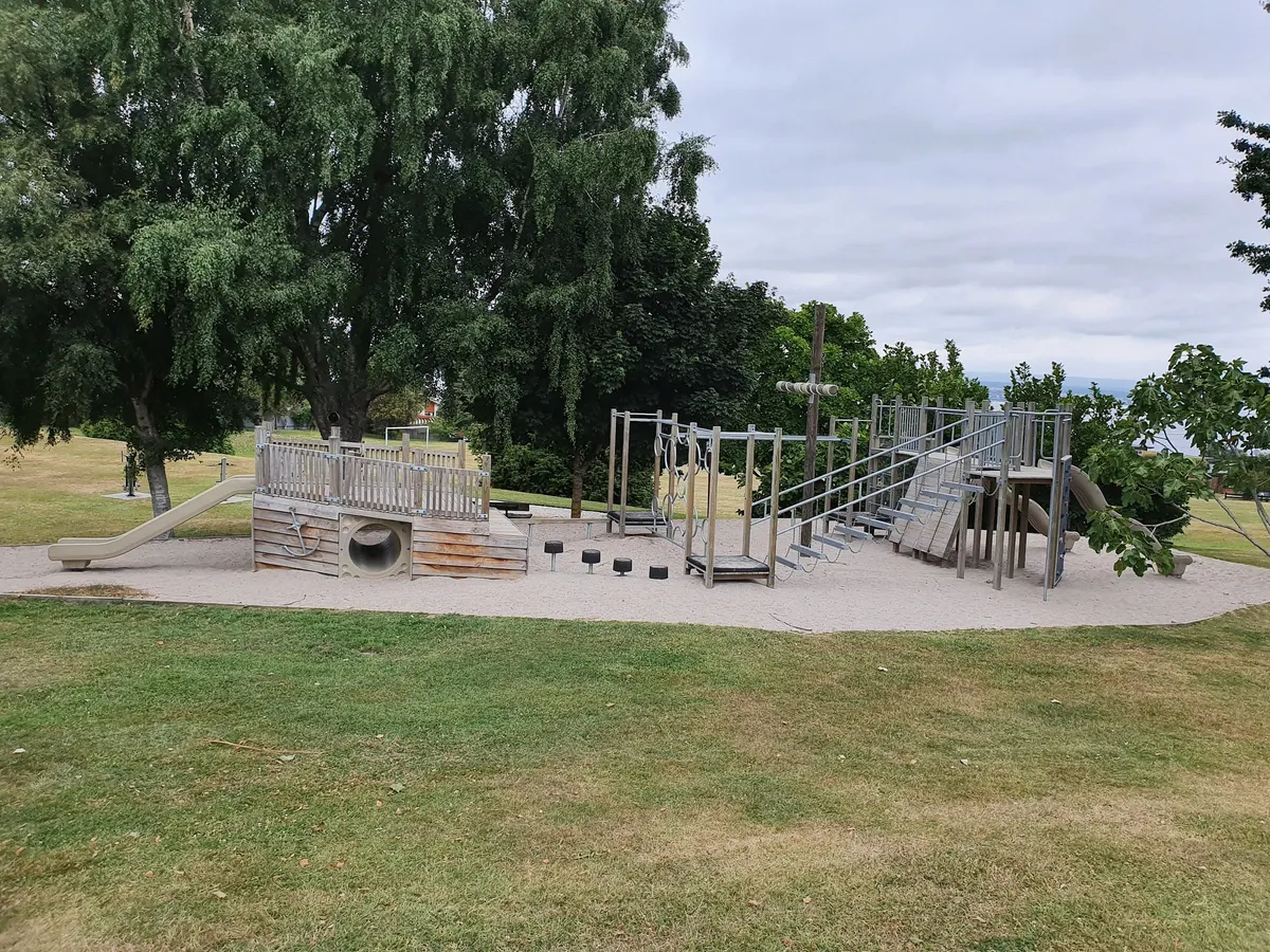 Wooden pirate ship play structure with tunnel and slides at Besley Park playground, Acacia Bay, Taupō