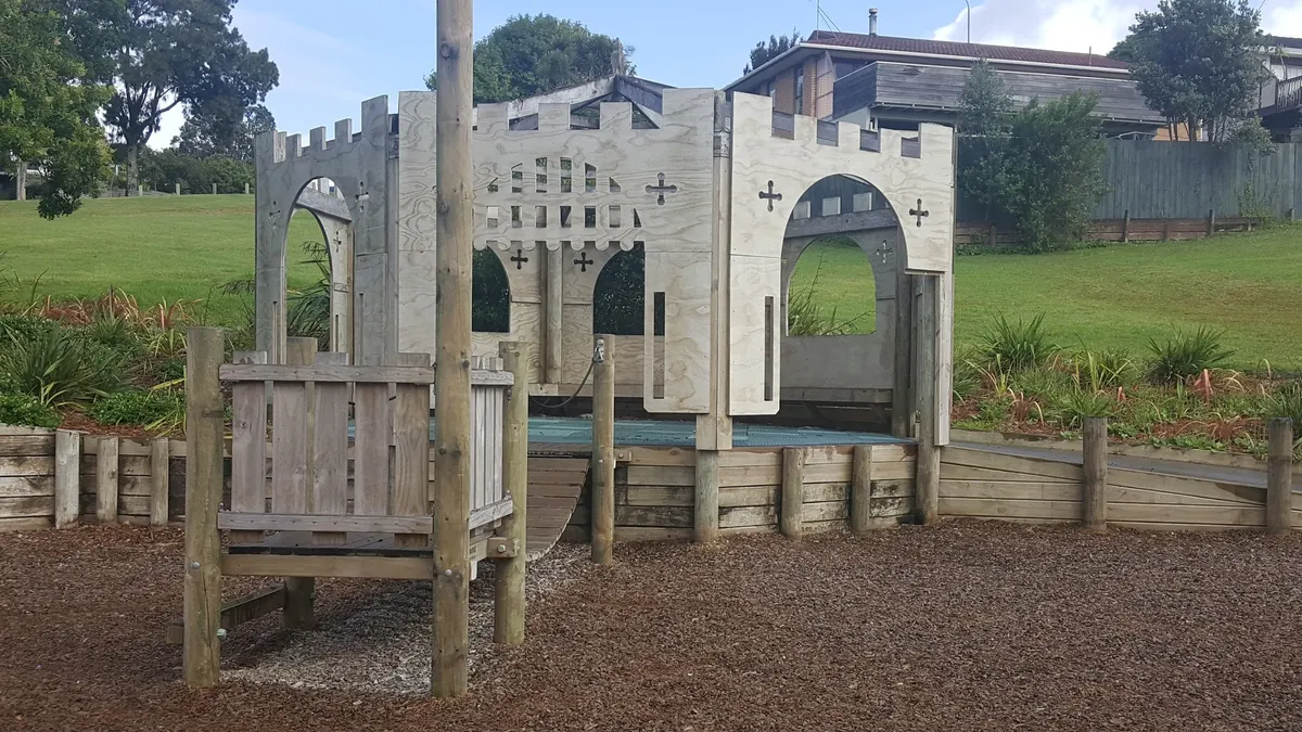 Wooden castle pavilion and climbing frames at Sherwood Playground, Browns Bay, Auckland