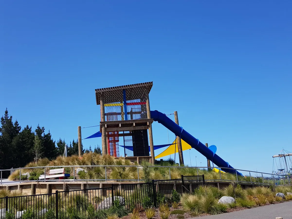 Tower and long blue tube slide on the mound at Foster Park Adventure Playground, Rolleston