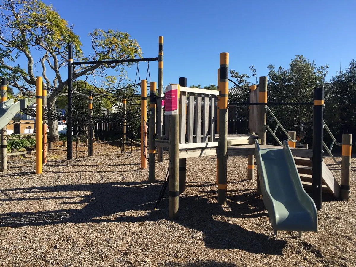 Ship-shaped rope net climber and slide at Essex Reserve playground, Mount Eden