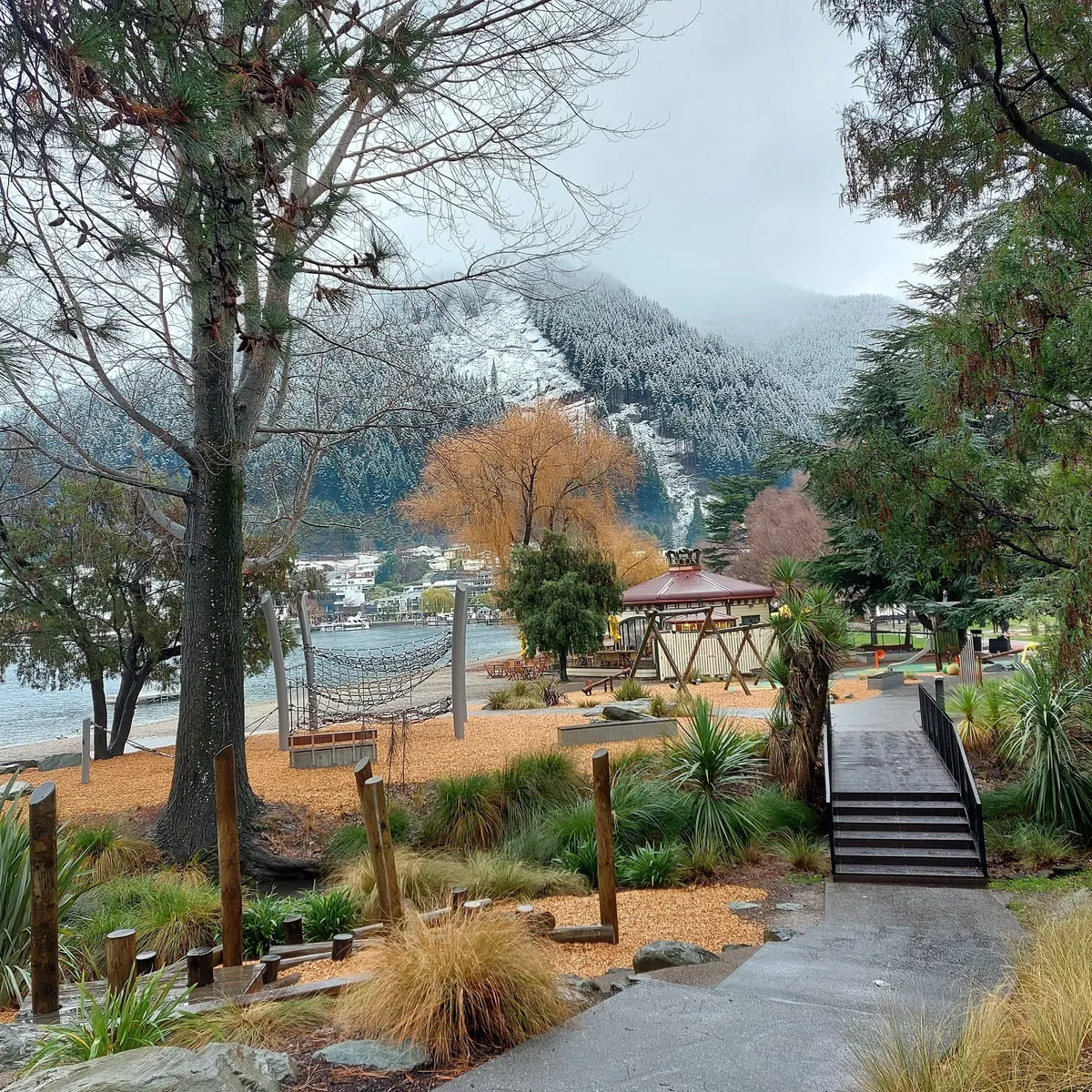 Rope net climber and play area beside Lake Wakatipu at Queenstown Gardens playground