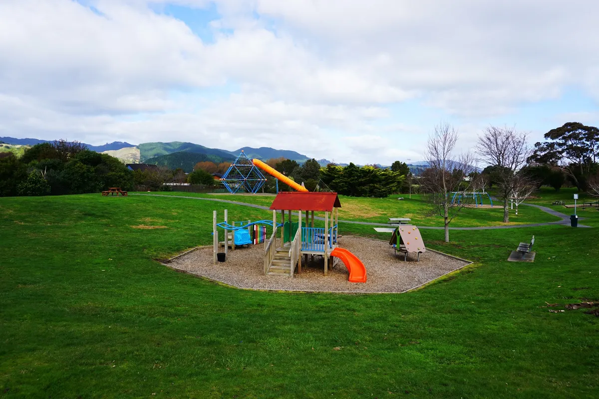 Climbing web, tall slide and play tower at Mazengarb Reserve playground, Paraparaumu