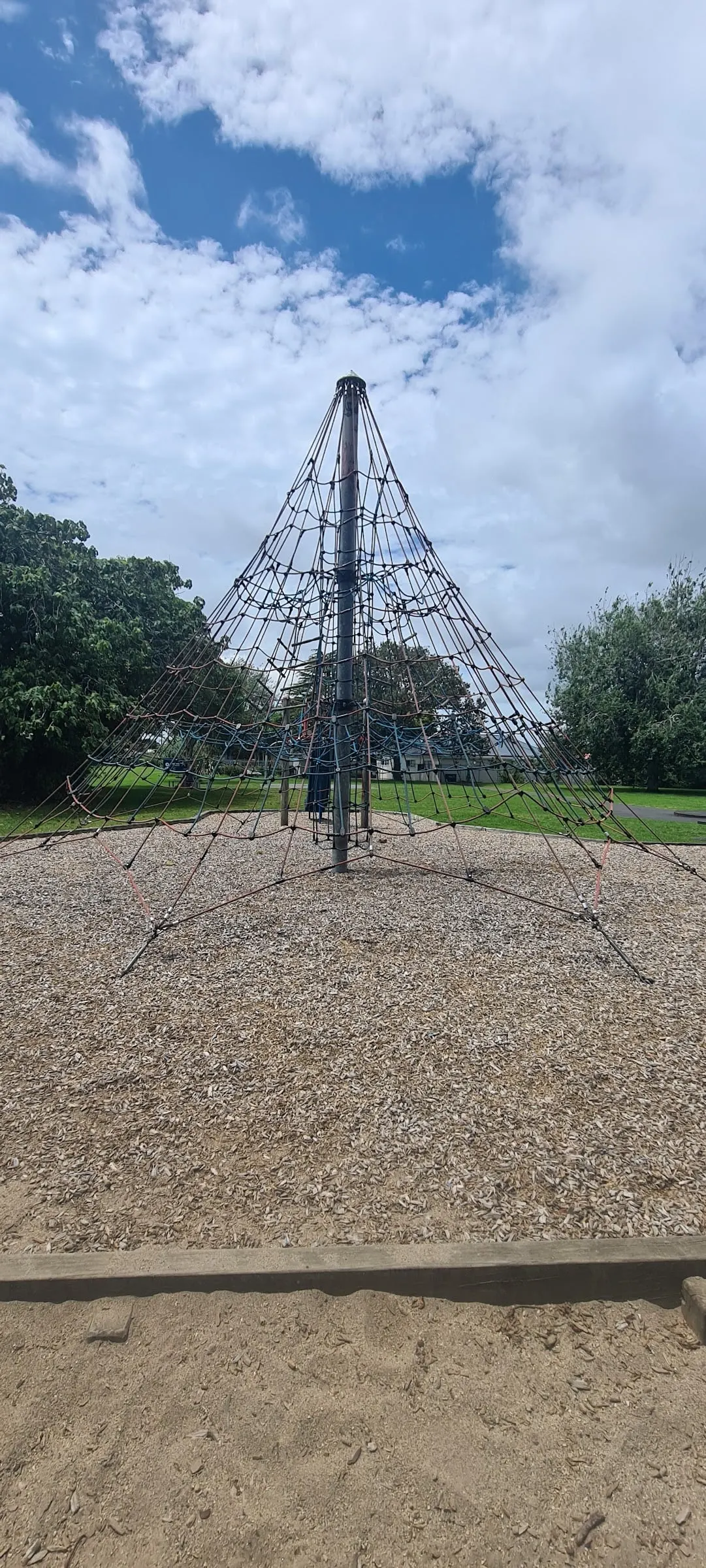 Supernova rope climbing pyramid on bark at Murphy Park Children's Playground, Ōtāhuhu