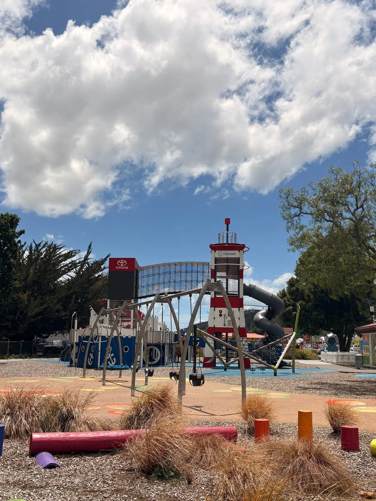Lighthouse climbing tower, tube slide and Wakatere boat at Porritt Park playground, Thames